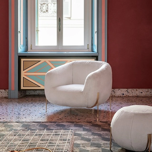 Poltroncina in tessuto dalla forma accogliente Geo di Saba